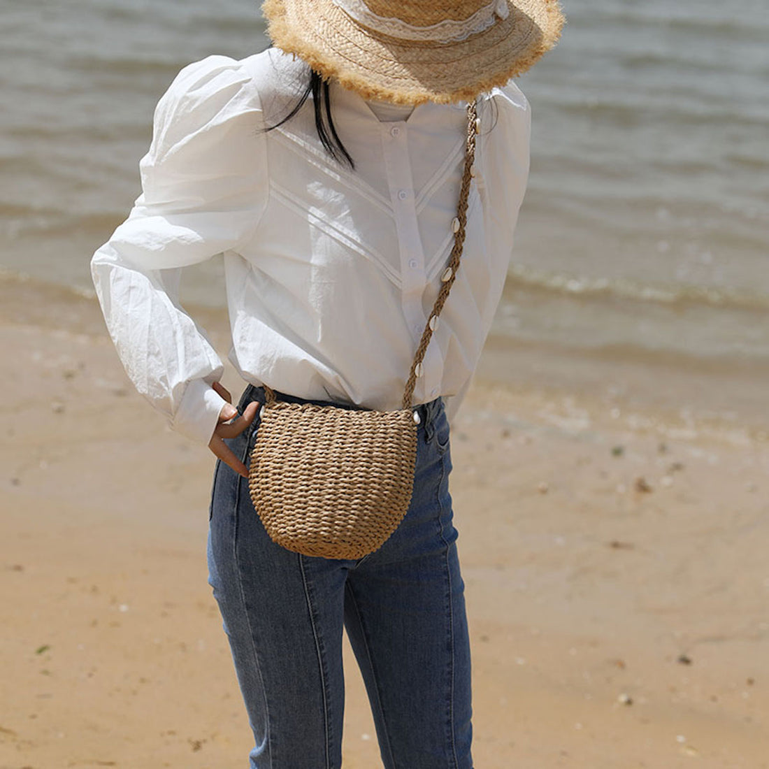 Seaside Chic: The Elena Handbags Straw Shoulder Bag with Sea Shells Strap